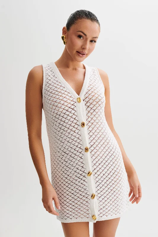 Floral print mini dresses for summer parties Delta Sleeveless Knit Button Up Mini Dress - Ivory Floral print mini dresses for summer parties Delta Sleeveless Knit Button Up Mini Dress - Ivory