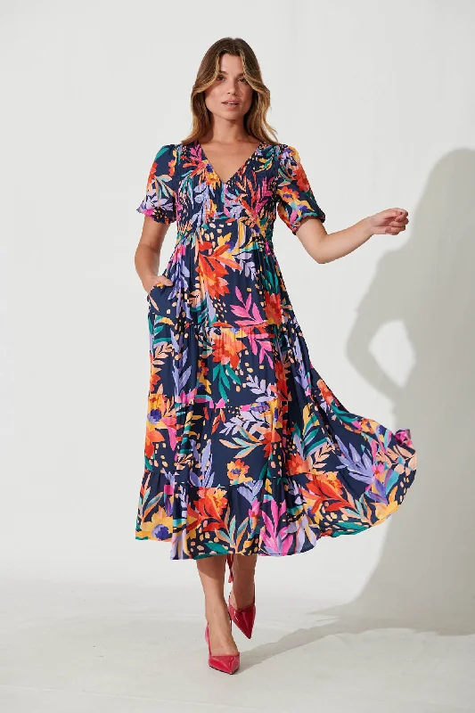 Maxi dresses with bow accents at the waist for a sweet appearanceKami Maxi Dress In Navy With Bright Leaf Print Maxi dresses with bow accents at the waist for a sweet appearanceKami Maxi Dress In Navy With Bright Leaf Print